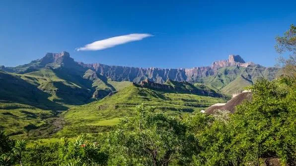 The Drakensberg Amphitheatre rising over a green South African valley